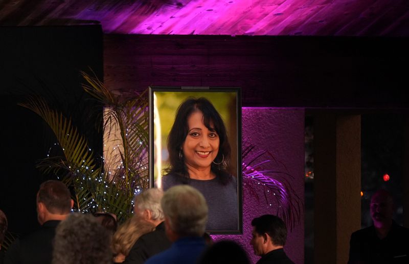 Community members gather for a March 14 candlelight vigil held in memory of murder victim Jessie Kirk, 72, at the Sand Point Park main pavilion in Titusville. David Armstrong Barber has been charged with first-degree murder in Kirk's March 4 death.