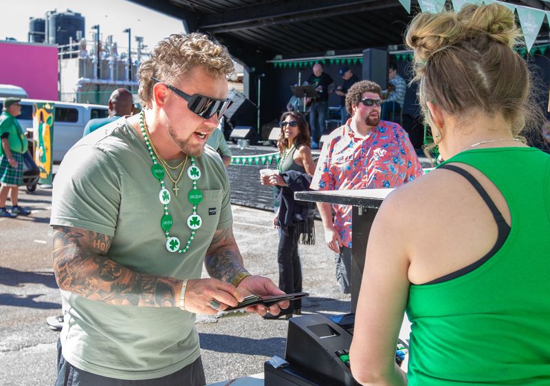 People celebrate St. Patrick's Day at Paddy O’Leary’s during the 38th annual St. Paddy’s Day Pub Crawl along Pensacola Beach on Monday, March 17, 2025.