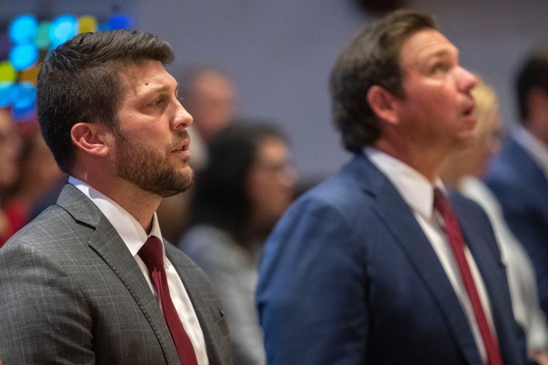 Gov. Ron DeSantis (right) attends the 50th annual Red Mass at the Co-Cathedral of St. Thomas More alongside new Attorney General of Florida James Uthmeier (left) Wednesday, March 19, 2025.