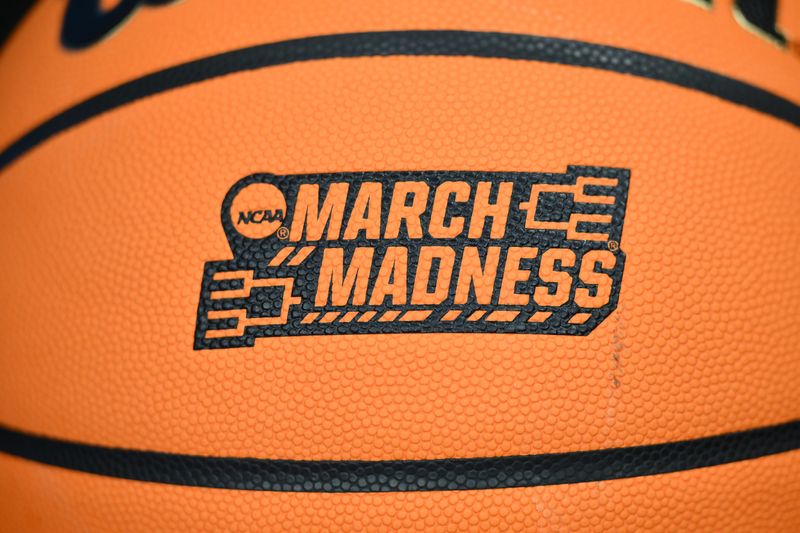 Mar 20, 2025; Seattle, WA, USA; The March Madness logo on a ball during the Memphis Tigers practice at Climate Pledge Arena. Mandatory Credit: Steven Bisig-Imagn Images