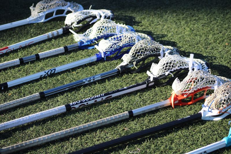 STOCK | Lacrosse sticks rest on the ground between halves of a high school boys lacrosse game between Bolles and Episcopal in Jacksonville, Florida, on March 21, 2025. [Clayton Freeman/Florida Times-Union]