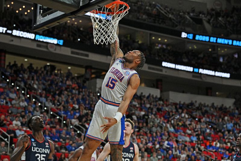 Mar 23, 2025; Raleigh, NC, USA; Florida Gators guard Alijah Martin (15) dunks the ball during the first half against the Connecticut Huskies in the second round of the NCAA Tournament at Lenovo Center. Mandatory Credit: Zachary Taft-Imagn Images
