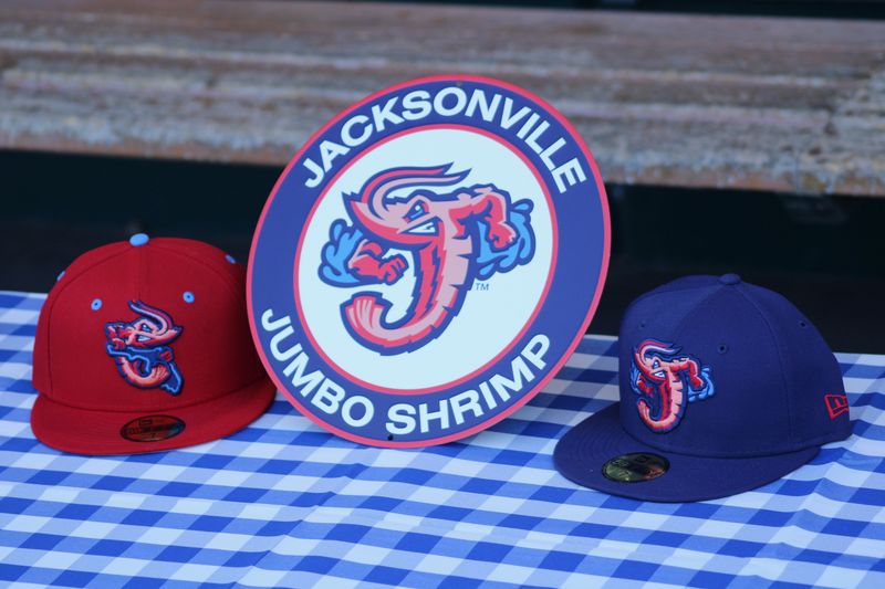 Jacksonville Jumbo Shrimp caps and a team logo are displayed at Media Day at VyStar Ballpark on March 26, 2025. [Clayton Freeman/Florida Times-Union]