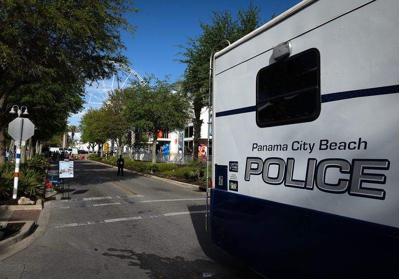 People are seen at Pier Park in Panama City Beach, Fla., April 4. The PCB Police Department is doing a heavy crackdown at the popular tourist destination after a March 29 shooting and receiving information on undefined future threats. The protective measures will be in place between Friday, April 4, and Monday, April 7 to ensure public safety. (Tyler Orsburn/News Herald)