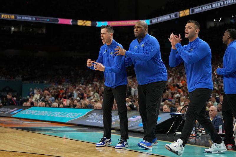 Apr 5, 2025; San Antonio, TX, USA; Florida Gators head coach Todd Golden and staff reacts after a play against the Auburn Tigers during the second half in the semifinals of the men's Final Four of the 2025 NCAA Tournament at the Alamodome. Mandatory Credit: Bob Donnan-Imagn Images