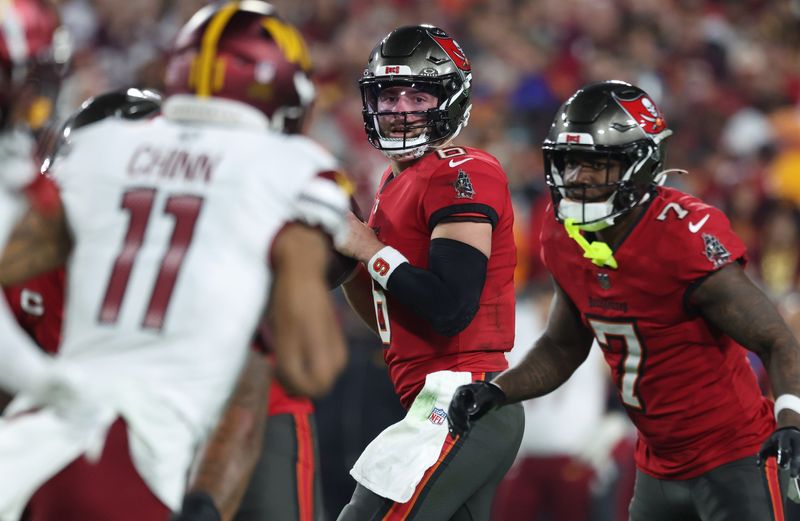 Jan 12, 2025; Tampa, Florida, USA; Tampa Bay Buccaneers quarterback Baker Mayfield (6) looks to pass during the first quarter of a NFC wild card playoff against the Washington Commanders at Raymond James Stadium. Mandatory Credit: Kim Klement Neitzel-Imagn Images