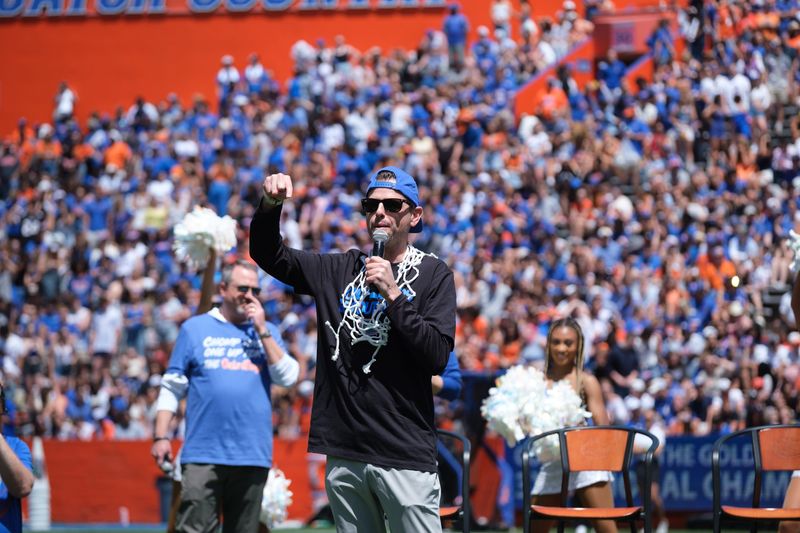 Florida Head Coach Todd Golden addresses the croud during the Florid Mens Basketball National Championship celebration at half time of the Orange and Blue spring football game at Ben Hill Griffen Stadium in Gainesville, FL on Saturday, April 12, 2025. [Chris Watkins/Gainesville Sun]