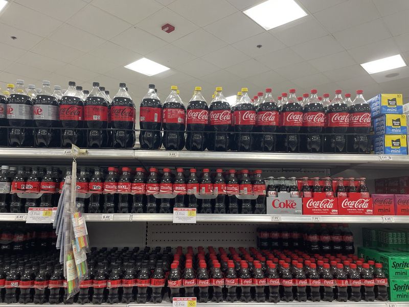 Kosher-for-Passover bottles of Coca-Cola line the soft drinks aisle of Publix in Jacksonville, Florida, for Passover 2025.