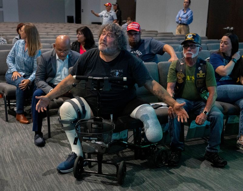 Veteran Bobby Cortese reacts to a question asked by an audience member about Medicaid to U.S. Rep. Brian Mast , R-FL, during a town hall meeting at Calvary Church in Jupiter, Florida on April 15, 2025.