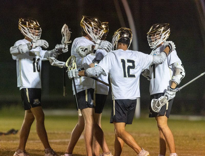 Buchholz celebrates a goal against Tocoi Creek during the 2025 FHSAA Boys Lacrosse 2a District 4 Tournament at Buchholz High School in Gainesville, FL on Tuesday, April 15, 2025. Buchholz won the championship 8-2. [Alan Youngblood/Gainesville Sun]