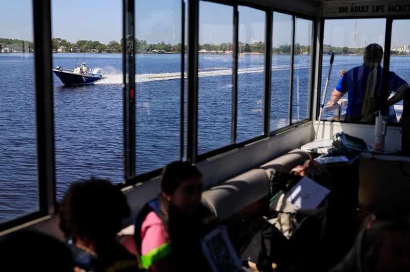 A motorboat passes during a Spring Park Elementary field trip aboard the St. Johns Explorer on the St. Johns River in April.