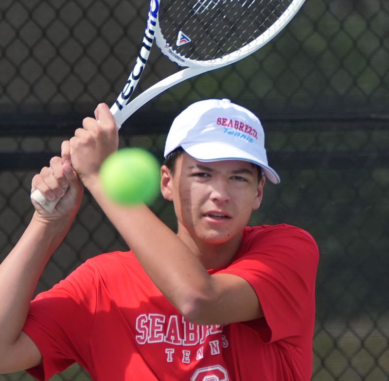 Seabreeze's JJ Martin watches his backhand return during regional doubles tennis action, Tuesday, April 22, 2025, at Embry-Riddle Aeronautical University.