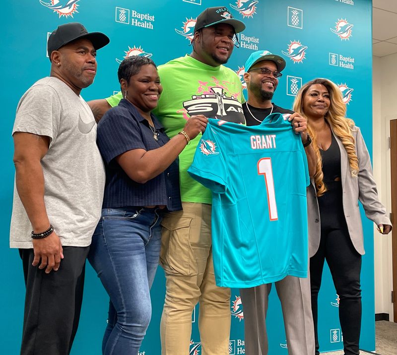 Miami Dolphins first-round pick Kenneth Grant with his family on Friday, April 25, 2025, in Miami Gardens.