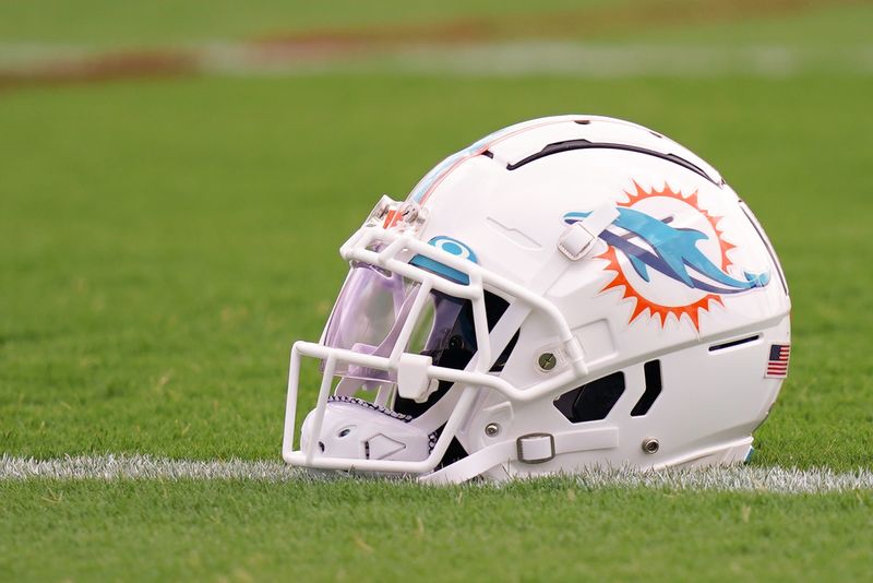 Jul 27, 2022; Miami Gardens, FL, USA; A general view of a Miami Dolphins helmet on the field during training camp at Baptist Health Training Complex. Mandatory Credit: Jasen Vinlove-USA TODAY Sports