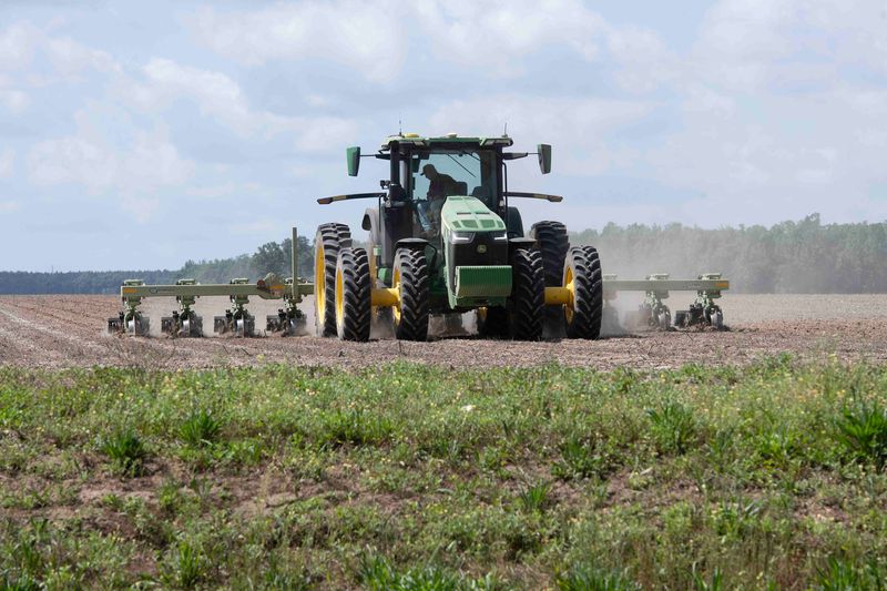 A farmer works the fields of Central Santa Rosa County, where residential developers have been gobbling up prime agricultural property to build homes. On May 8, the Board of County Commissioners will hold a public hearing to discuss a proposal to move an existing rural protection zone four miles south to the boundary line between the Pace and Allentown fire districts.