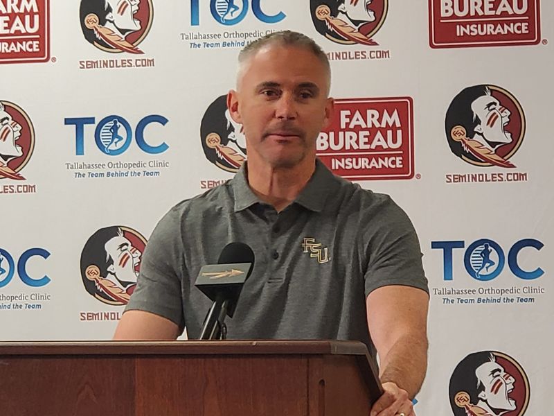 FSU football coach Mike Norvell stands in the podium to talk to media about post spring on Wednesday, April 30, 2025.