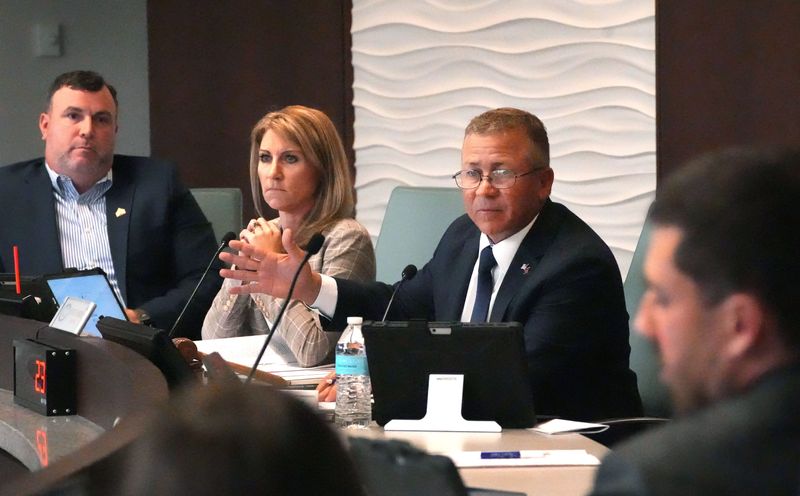 Palm Coast Mayor Mike Norris speaks as Councilmember Ty Miller, District 1, and Vice Mayor Theresa Carli Pontieri, District 2, listen, Thursday, May 1, 2025, as the results of an independent investigation of ethics complaints against Norris are discussed at a meeting.