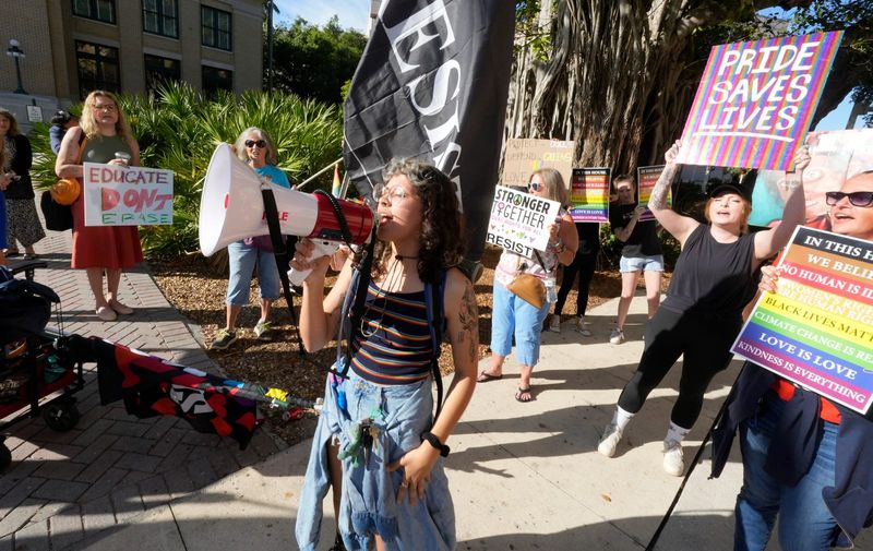 Naples Pride supporters gathered in front of the old Lee County Courthouse building in downtown Fort Myers Friday, May 2, 2025 to protest ahead of a court hearing after they filed a federal lawsuit against the city of Naples. The lawsuit was filed after officials denied a permit for its outdoor drag show. Counter protesters were also present and both groups clashed during the protest.
