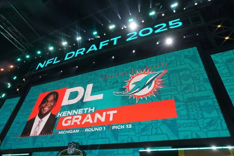 Apr 24, 2025; Green Bay, WI, USA; Michigan Wolverines defensive lineman Kenneth Grant is selected as the No. 13 pick by the Miami Dolphins during the NFL Draft at Lambeau Field. Mandatory Credit: Kirby Lee-Imagn Images