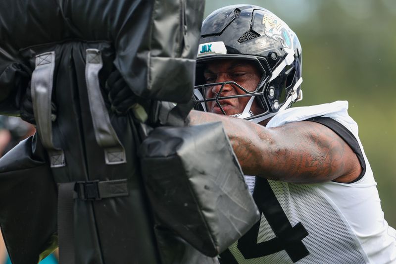 Jul 26, 2024; Jacksonville, FL, USA; Jacksonville Jaguars defensive tackle Maason Smith (94) participates in training camp at Miller Electric Center. Mandatory Credit: Nathan Ray Seebeck-USA TODAY Sports