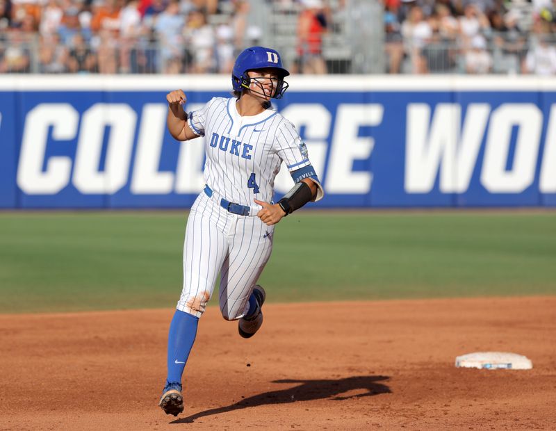 Duke infielder Ana Gold (4) celebrates after hitting a home run in the second inning of a Women's College World Series softball game between the Alabama Crimson Tide and the Duke Blue Devils at Devon Park in Oklahoma City, Friday, May 31, 2024. Alabama won 2-1.