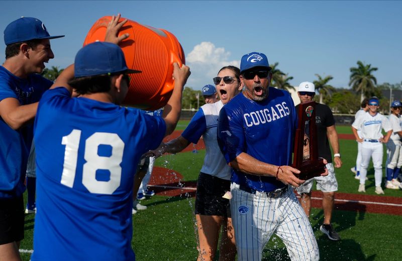 Canterbury School coach Frank Turco is doused with water after the team victory against St. John Neumann. The Canterbury School baseball team took down visiting St. John Neumann May 8, 2025 to win the Class 1A-Region 3 regional final playoff matchup with a final score of 2-1.