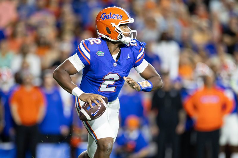 Oct 19, 2024; Gainesville, Florida, USA; Florida Gators quarterback DJ Lagway (2) scrambles with the ball against the Kentucky Wildcats during the first half at Ben Hill Griffin Stadium. Mandatory Credit: Matt Pendleton-Imagn Images