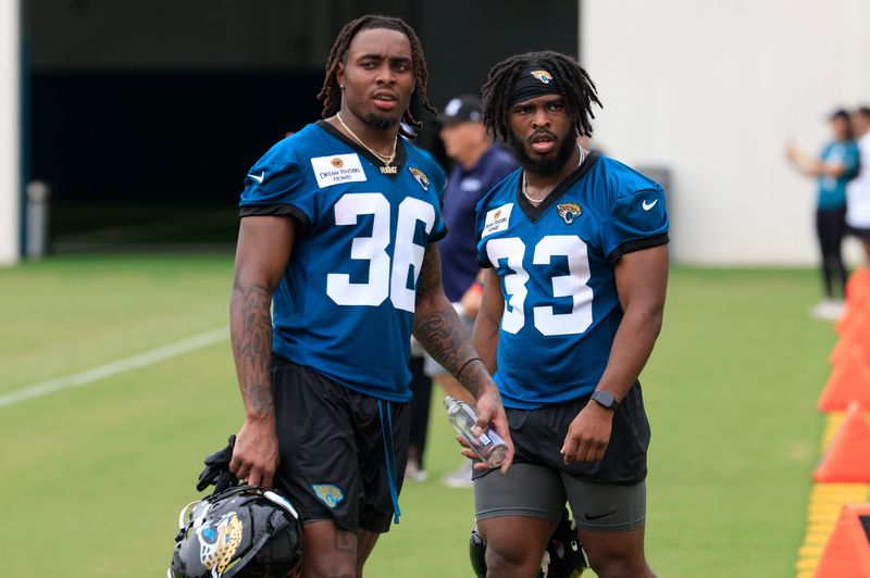 Jacksonville Jaguars running back LeQuint Allen (36) and running back Bhayshul Tuten (33) look on during a rookie minicamp at Miller Electric Center Saturday, May 10, 2025 in Jacksonville, Fla. [Corey Perrine/Florida Times-Union]