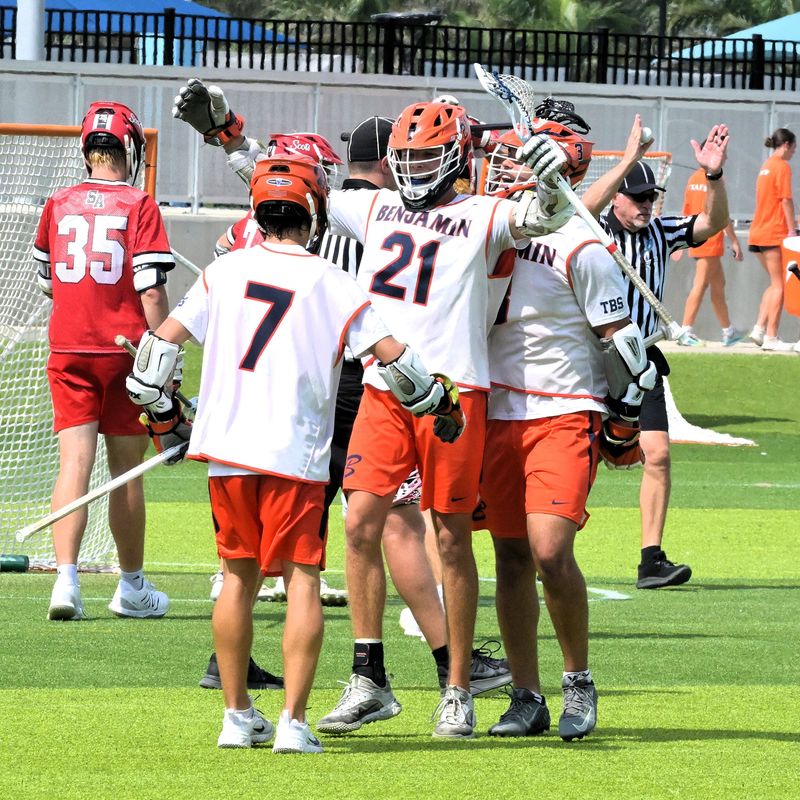 Benjamin's Campbell Hogan is praised after a score during a state championship 14-11 win against St. Andrew's on May 10, 2025.