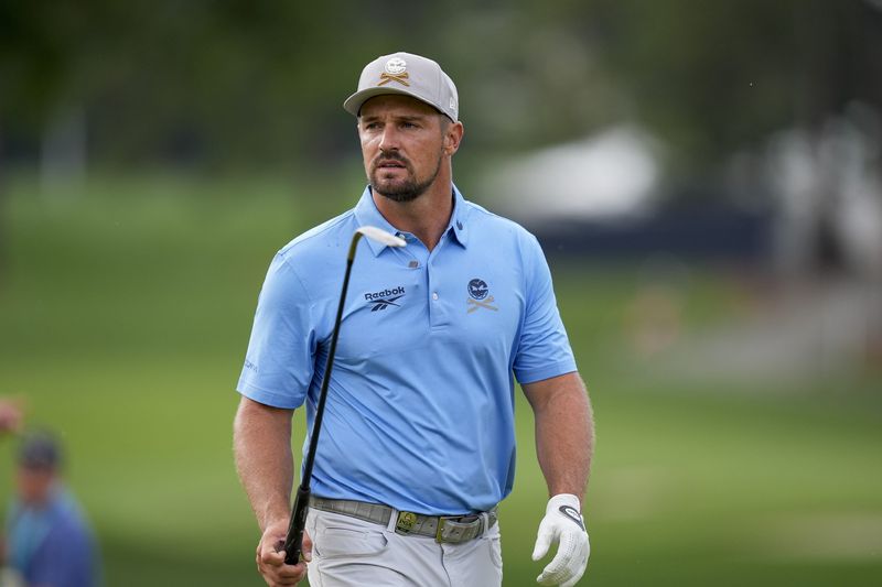 Bryson DeChambeau walks up to the fifth green during a practice round for the PGA Championship golf tournament at Quail Hollow on May 13, 2025.