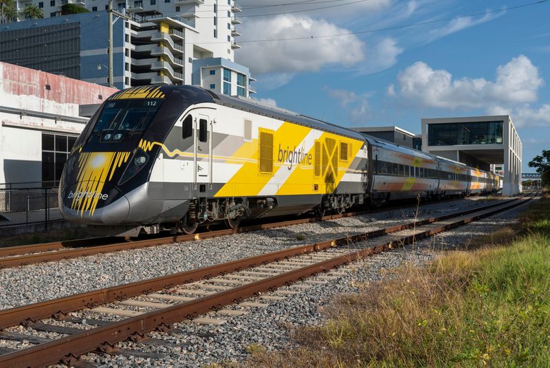 A Brightline train leaves the West Palm Beach, Florida, station on Sept. 6, 2023. No longer exclusively a South Florida service, Brightline runs from Orlando International Airport to downtown Miami and has plans to expand to the Tampa Bay area. (ANDRES LEIVA/PALM BEACH POST)