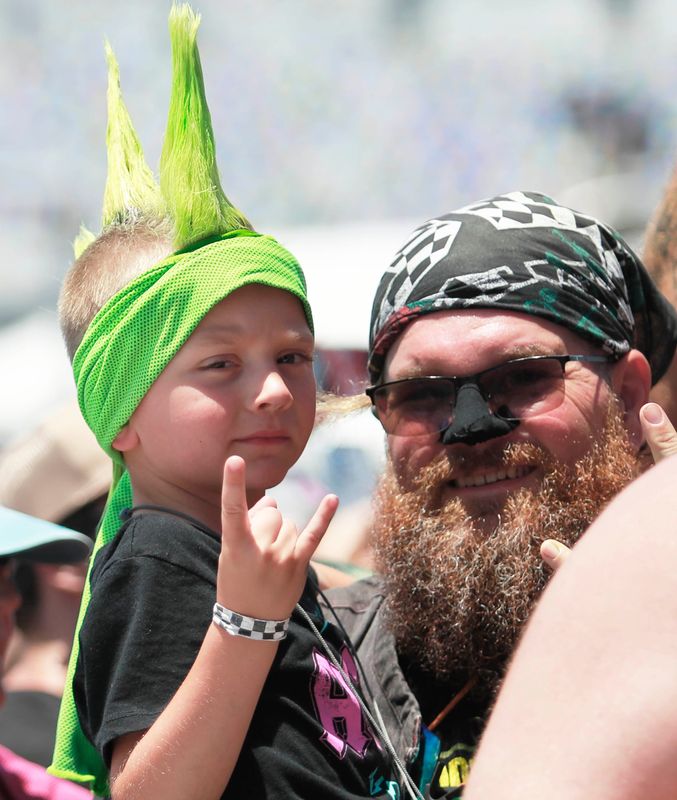 A young rock enthusiast jams with his dad during day 3 of Welcome to Rockville at Daytona International Speedway, Saturday, May 17, 2025.