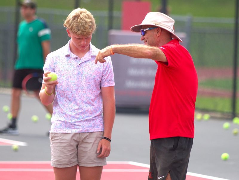 Friends, students and more gather to send off Leon tennis coach Kevin Record on May 20 as he embarks on his global bike journey to raise money for Alzheimer's research