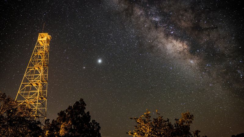 The Milky Way looms over the old fire tower at Fakahatchee Strand Preserve State Park in Copeland, Florida, in the early morning hours of June 17, 2020.