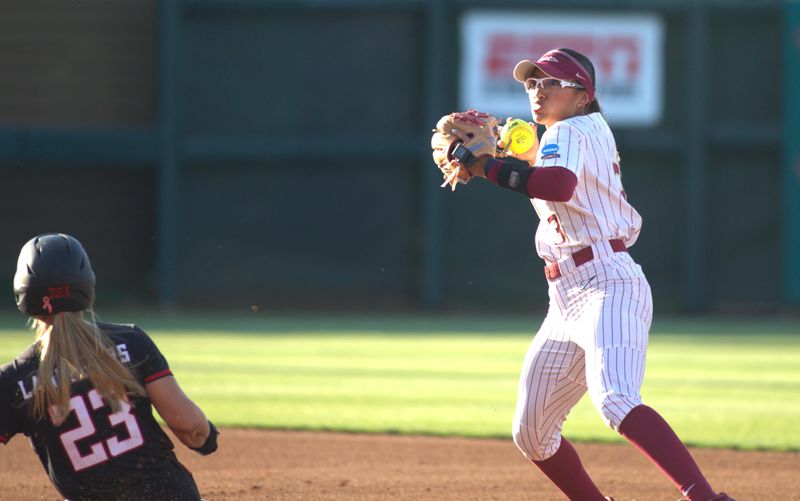 Florida State softball's Isa Torres (#3) turns a double play against Texas Tech in the NCAA Super Regionals