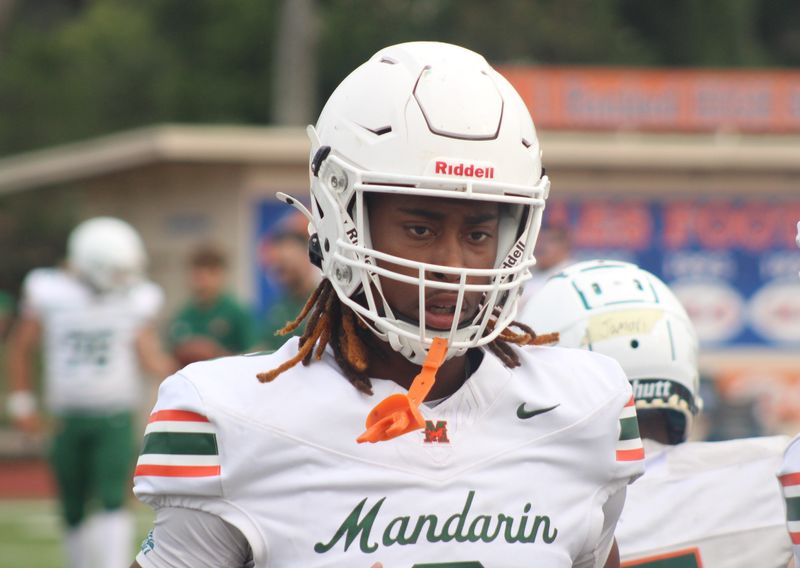 Mandarin cornerback Brody Jennings (3) runs through pregame warm-ups before a high school spring football game at Bolles.