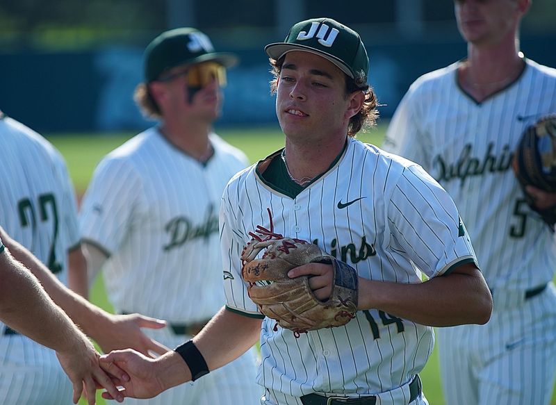 Sammy Mummau of Jacksonville University (14) hit a walk-off RBI double on May 23 to lift the Dolphins over North Alabama 3-2 in an ASUN Tournament elimination game in DeLand.