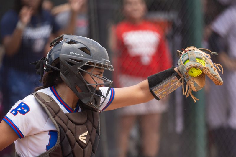 Pace's Lana Gonzales (2) squeezes the pitch during the Pace softball team's loss to Doral Academy in the Class 6A state championship game on Saturday, May 24, 2025, at Boombah-Soldiers Creek Park in Longwood.