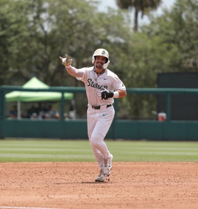 Stetson’s Isaiah Barkett (13) hits a home run during the ASUN baseball tournament finals, Sunday, May 25, 2025, at Melching Field in DeLand.