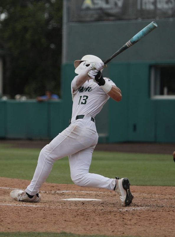 Stetson’s Isaiah Barkett (13) hits a home run during the ASUN baseball tournament finals, Sunday, May 25, 2025, at Melching Field in DeLand.