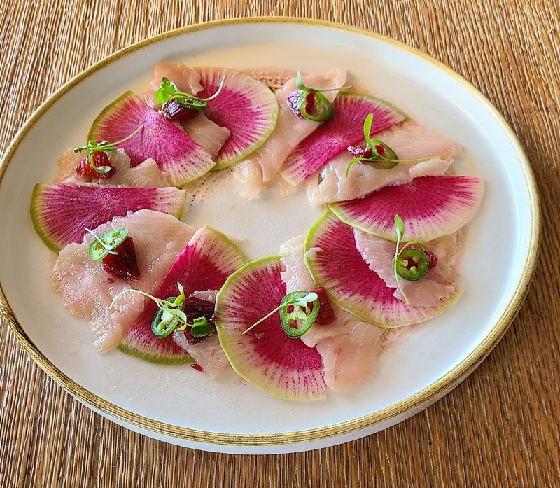 Aquasan's hamachi with watermelon radish and serrano pepper.