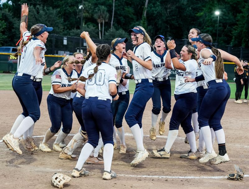 The Fort Walton Beach Vikings celebrate their win over American Heritage in the FHSAA Class 4A softball state final May 23, 2025. Craig Bailey/FLORIDA TODAY via USA TODAY NETWORK