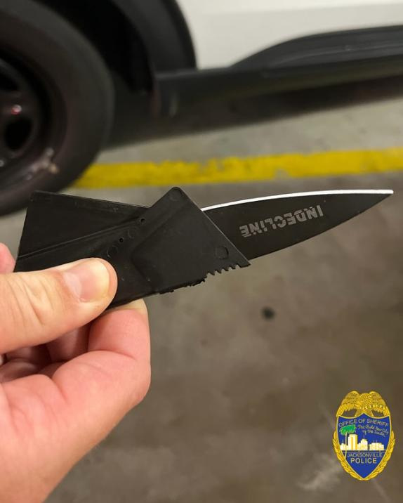 The Jacksonville Sheriff's Office found this "folding credit card knife" in a wallet belonging to Conor Cauley, 29, when he was arrested May 27, 2025 at Jacksonville City Hall on charges of carrying a concealed weapon in a local government building. Cauley also was arrested on a charge of resisting an officer with violence during the arrest.