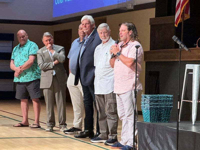 Pastors from churches around the area took turns praying for the various categories of business represented at the Blessing of the Marketplace.