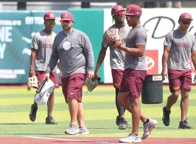 Bethune-Cookman head coach Jonathan Hernandez walks with players during practice at Jackie Robinson Ballpark, Wednesday, May 28, 2025.