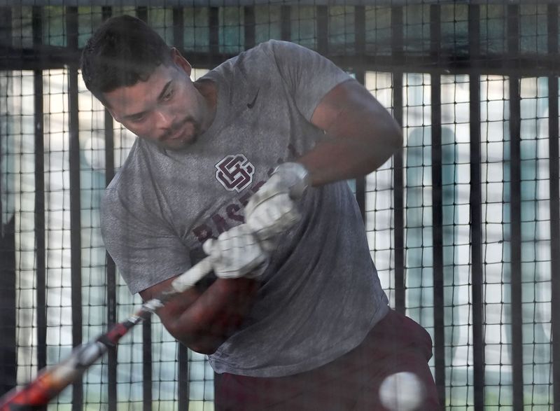 Bethune Cookman University's Andrey Martinez swings in the batting cage, Wednesday, May 28, 2025 during practice at Jackie Robinson Ballpark before leaving for the NCAA Tournament.