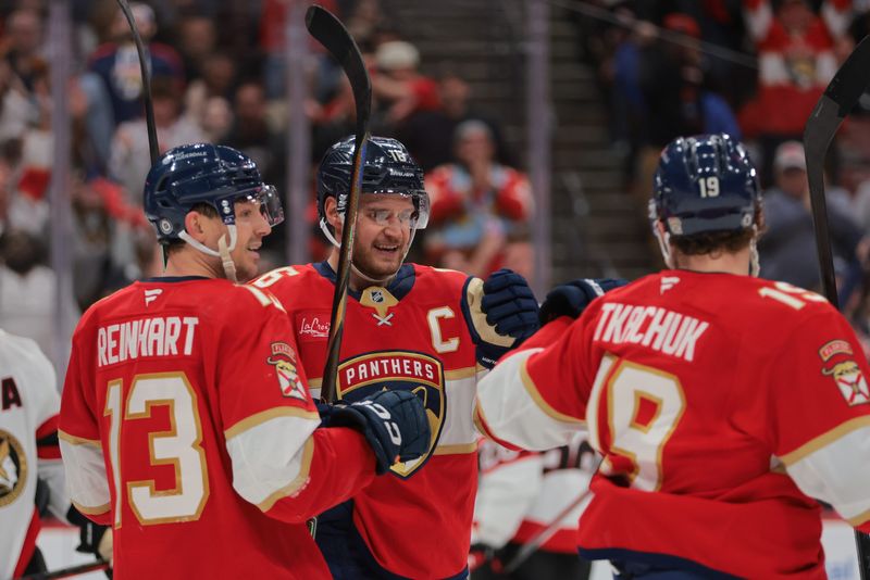 Feb 8, 2025; Sunrise, Florida, USA; Florida Panthers center Aleksander Barkov (16) celebrates with center Sam Reinhart (13) and left wing Matthew Tkachuk (19) after scoring against the Ottawa Senators during the second period at Amerant Bank Arena. Mandatory Credit: Sam Navarro-Imagn Images