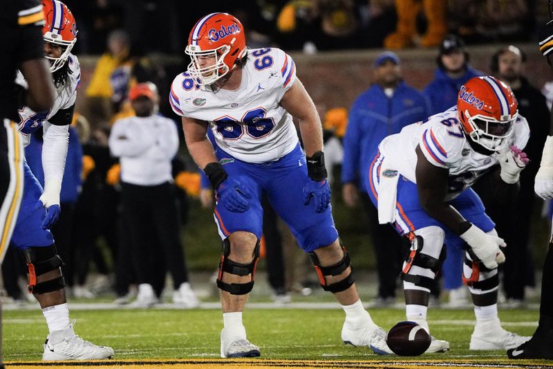 Nov 18, 2023; Columbia, Missouri, USA; Florida Gators offensive lineman Jake Slaughter (66) at the line of scrimmage against the Missouri Tigers during the game at Faurot Field at Memorial Stadium. Mandatory Credit: Denny Medley-USA TODAY Sports