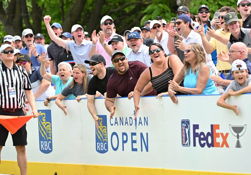 Jun 10, 2023; Toronto, ON, CAN; Fans react following the tee shot of Nick Taylor at the hockey themed 14th hole during the third round of the RBC Canadian Open golf tournament. Mandatory Credit: Dan Hamilton-USA TODAY Sports