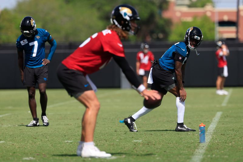 Jaguars wide receiver Dyami Brown (5) looks to quarterback Trevor Lawrence (16) during the 10th organized team activity.
